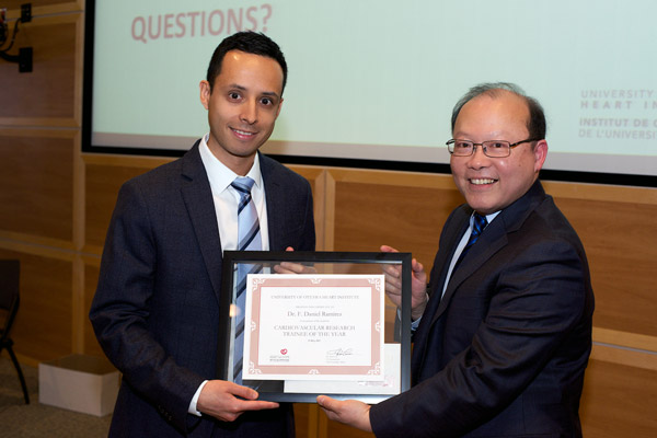 Dr. F. Daniel Ramirez received the Trainee of the Year Award from Dr. Peter Liu, Chief Scientific Officer, UOHI