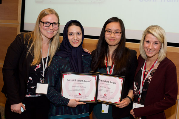 Centre left: Ms. Ghazaleh Rafatian (Davis lab) and centre right: Ms. Anh-Thu Dang (McPherson lab) received the Hustle and Heart Award for Significant Contributions to the Work in Progress Rounds. Far left: Dr. Lisa Cotie (Reid group), Co-Chair, Trainee Committee and far right: Ms. Sandrine Parent (Davis lab), Work in Progress Rounds Coordinator.