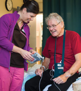 Showing a patient a blood pressure monitor