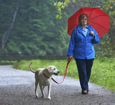 Woman walking a dog 