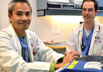 Heart Institute cardiologist Dr. Derek So (left) and former resident Dr. Jason Roberts