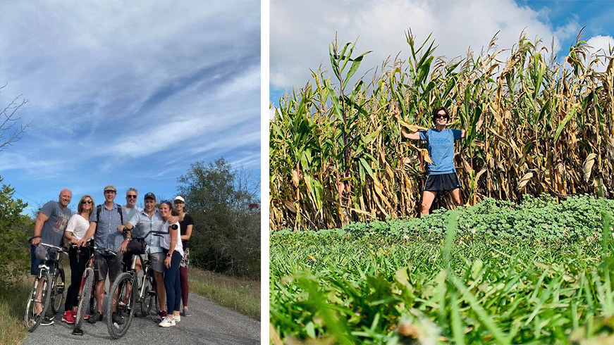 A group of participants on bicycles. A participant standing in a corn field.