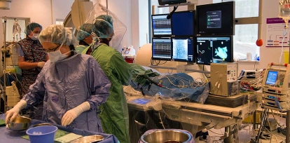 The team in the electrophysiology (EP) lab includes an anesthesiologist, a scrub nurse and fellowship trainees.