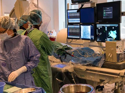 The team in the electrophysiology (EP) lab includes an anesthesiologist, a scrub nurse and fellowship trainees.