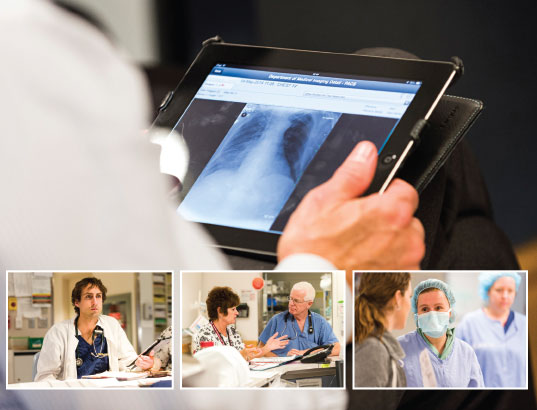 Un professionnel du domaine de la santé regarde une image numérique d'un rayon X sur une tablette